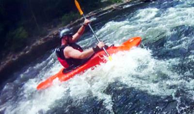 me whitewater kayaking...in the act of wrecking my wrist and getting tendonitis